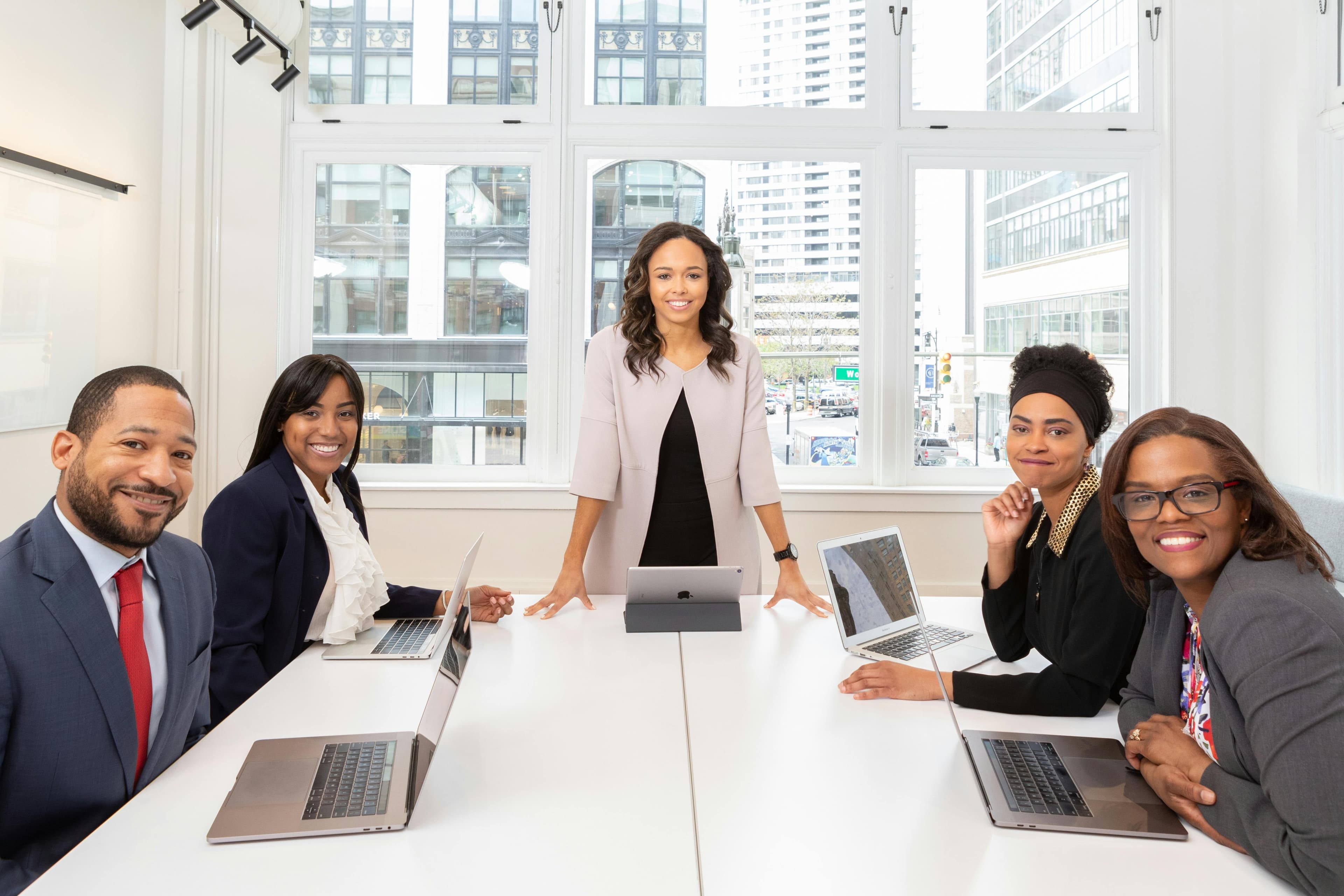 WiseWage team gathered around a meeting table in a bright office