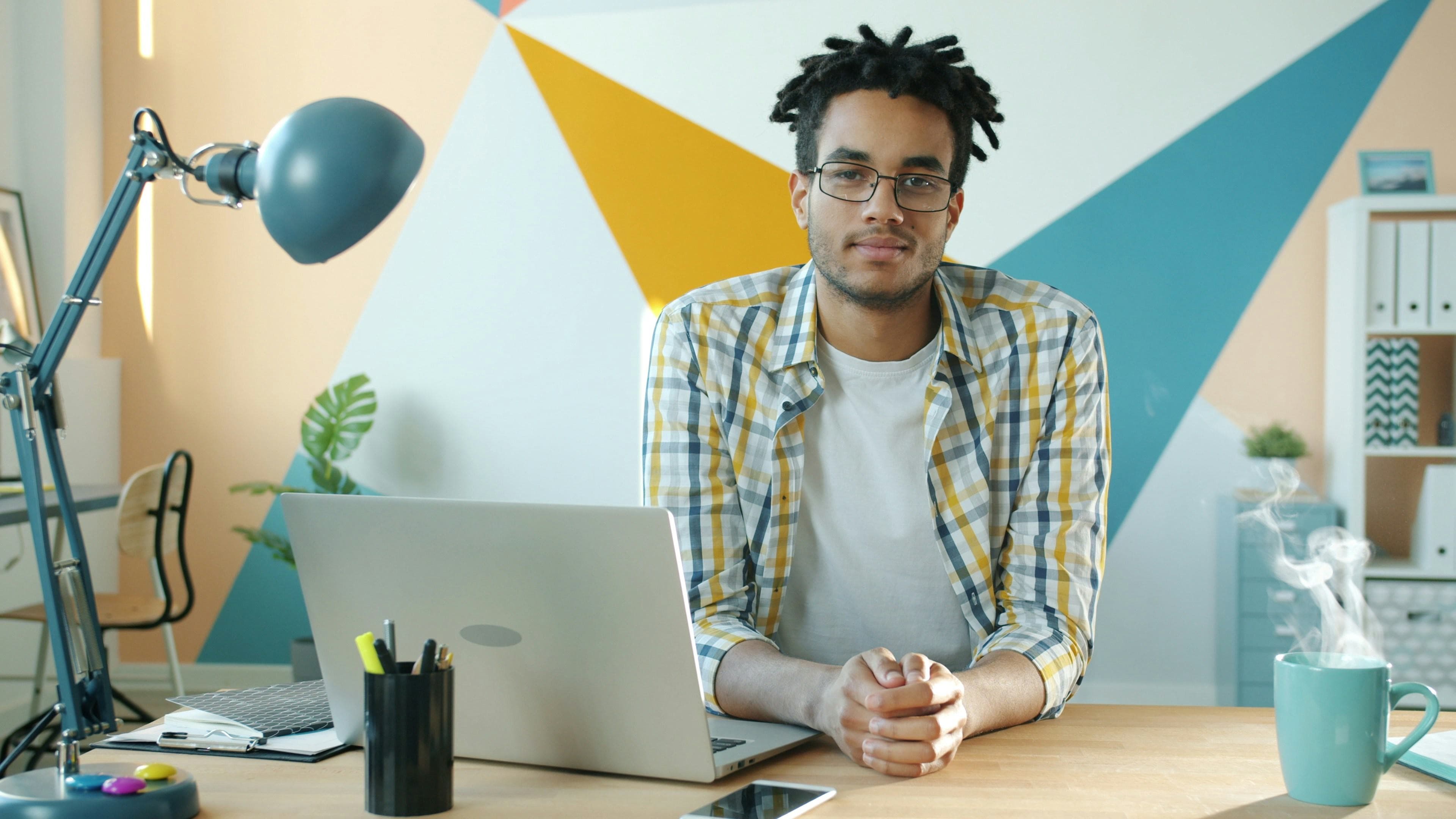 Team member at a desk representing WiseWage HR self-service