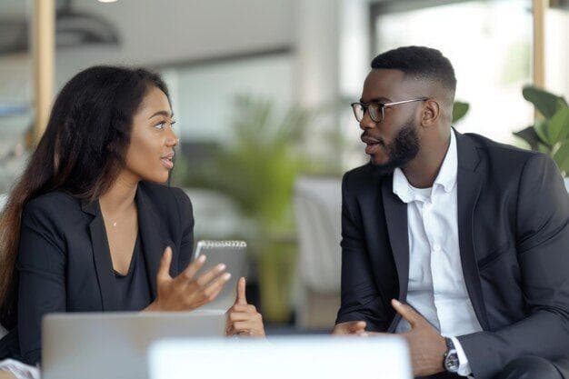 Two colleagues discussing learning and development opportunities